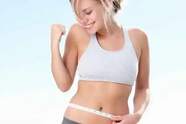 Unraveling the Mystery: Where Does the Body Fat Loss From First? 3 Image of woman happy with fat loss Reigate
